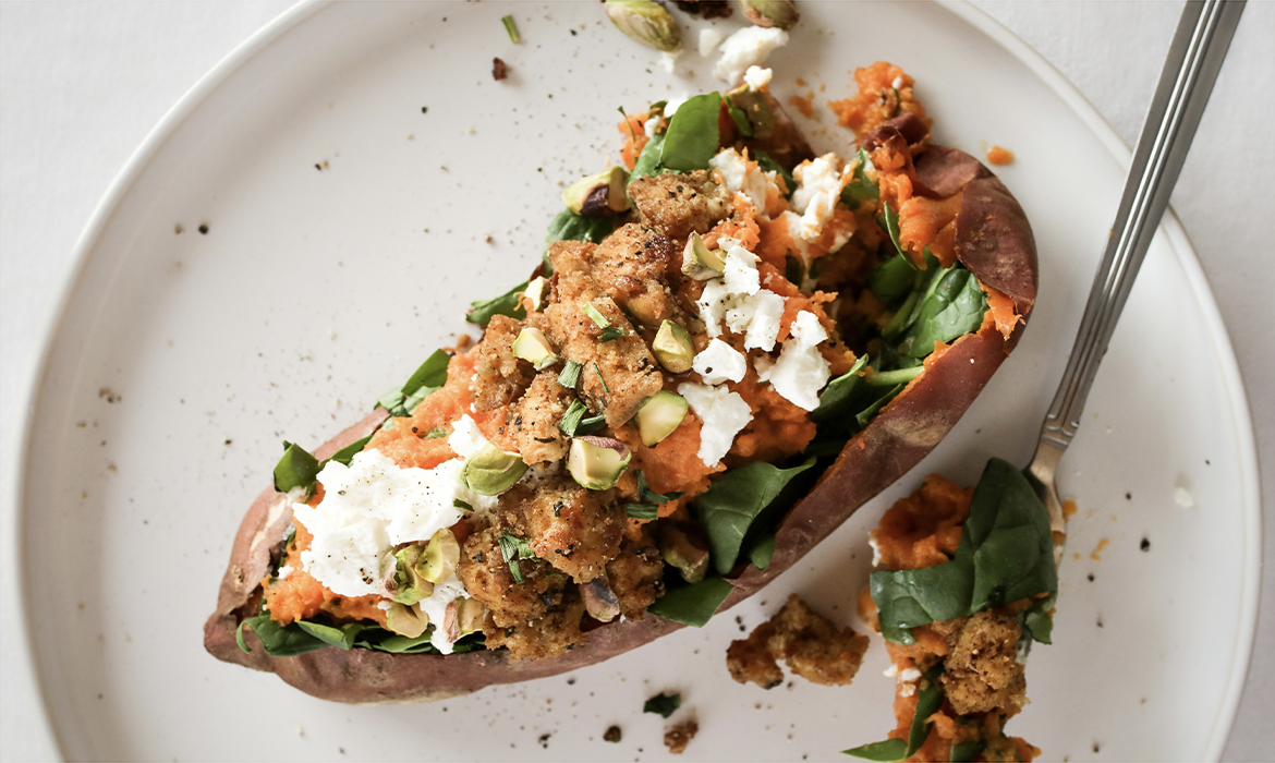 Sweet potato stuffed with goat cheese, pistachios, chives & tofu